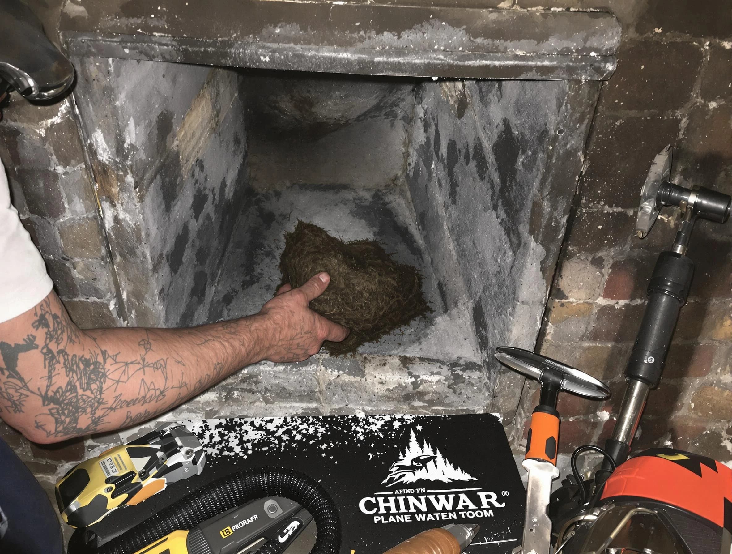 Lake of the Woods Chimney Sweep safely removing debris and screening chimney in Lake of the Woods, VA